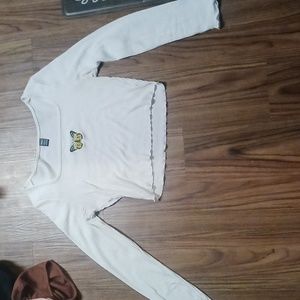 white crop top with a butterfly at the top